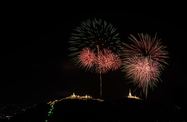 Firework and mountain on the night.