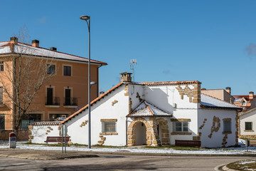Panoramic of Riaza with the remains of snow still on the roofs and mountains