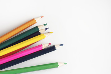 Bright colored pencils on a white background. Mocap