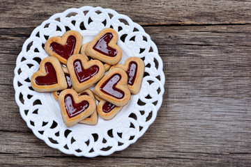 Group of heart cookies in a plate on table