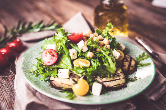Fresh healthy salad with chickpea and griled eggplant