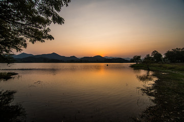 Fototapeta na wymiar Landscape reservoir and mountain on sunset.