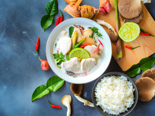 Thai galangal chicken soup in coconut milk or Tom Kha Gai, famous traditional Thai food serve with...