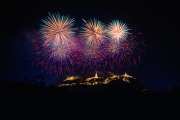 Fototapeta na wymiar Fireworks show over Phra Nakhon Khiri Historical Park (Khao Wang), Petchaburi, Thailand.