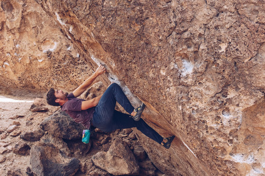 Young Man Bouldering Outside 