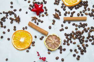 Dried orange, sugar straws and coffee beans on white background. Top view