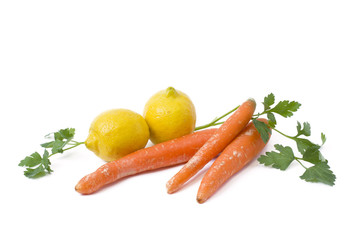 Fruits on a white background. Lemon with apples and kiwi on white background. Kiwi with lemon on a white background. Carrots with fruits on a white background.