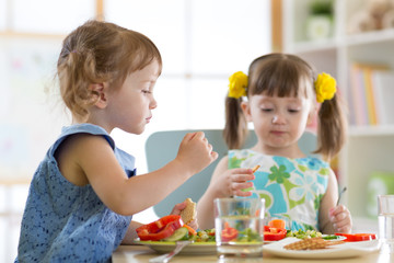 children eating food in daycare centre