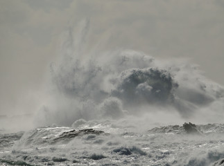 Rough sea and big explosion of water, wave breaking on the rocks, coast of Gran canaria