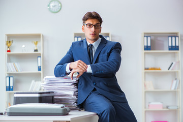 Businessman making copies in copying machine