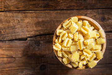 Raw Pasta Radiatori in Wooden Bowl