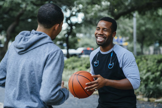 Two men playing basketball