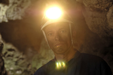 portrait of a miner inside a mine