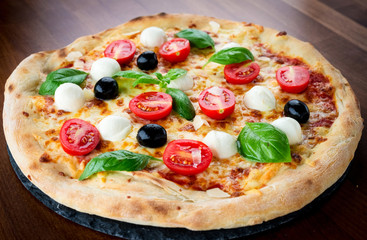 Pizza on rustic background