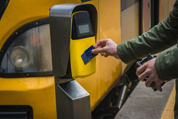 Passengers rush to the train, validate tickets, fare, public transport.