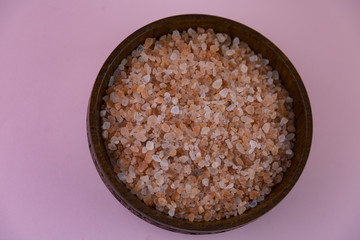 pink Himalayan salt inside a wooden bowl