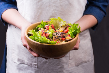 Meat salad on wooden table