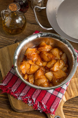 Chunks of chicken in marinade.