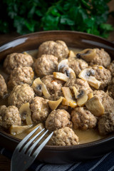 Delicious homemade swedish meatballs with mushroom cream sauce. Small depth of field.