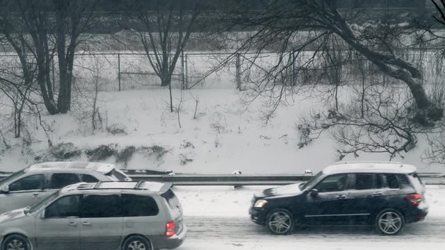 Commuter traffic moving slowly along DVP during snow storm.