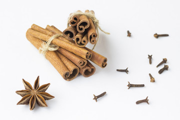Spices: star anise and cinnamon sticks on white background. Close up. Top view.