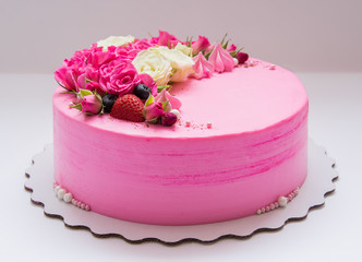 Beautiful biscuit cake with flowers and berries