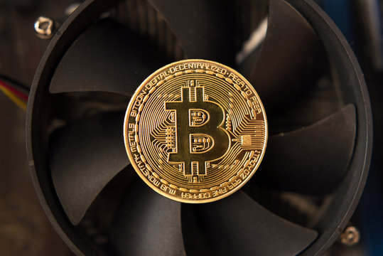 Bitcoin on the fan of a computer graphics card (mining - concept)