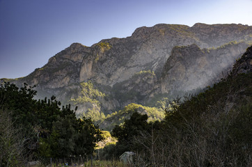 Lycian trail in Turkey, a view of the mountains filled with the morning sun, with an incredibly beautiful haze of morning mist