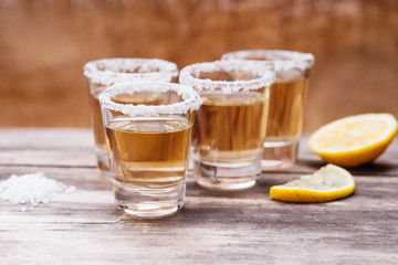 Tequila shots with lime fruits and salt 
