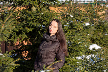 Young beautiful girl posing in winter Park