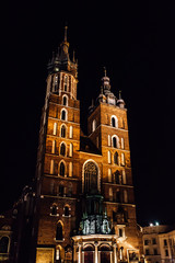 Fototapeta na wymiar Night old commercial area of Krakow in the lights of street lamps.