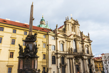 Fototapeta na wymiar St.Nicholas Church and square front of cathedral in the quarter of Mala Strana in Prague in Central Europe, facade of Baroque architecture