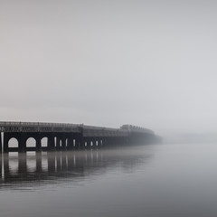 Fototapeta na wymiar The Tay bridge in Dundee disappearing into the fog.