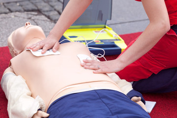 CPR course using automated external defibrillator device - AED - obrazy, fototapety, plakaty