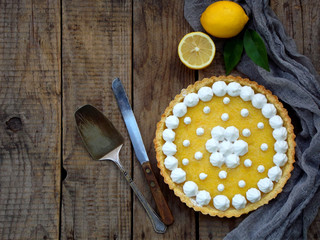 Lemon tart pie with meringue cream. Traditional American cake. Homemade baking. Copy space