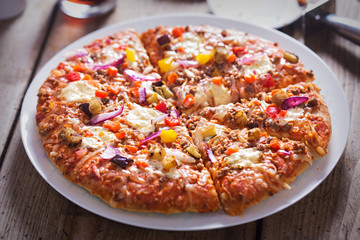 Turkish kebab pizza with beef, pepper, aubergine and red onions 