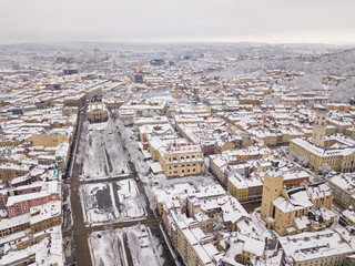 Beautiful photo in winter, snow, holidays Lviv, Ukraine, panorama, downtown bird's-eye view, the historical part of the city, of drone