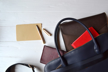 Business bag and empty paper on the desk. Business flat lay.