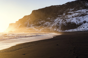 North Atlantic coast and the Reynisfjell mountain at Reynisfjara black sand beach in the Southern Region of Iceland near the coastal village of Vik i Myrdal.