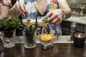 The barman is making tropical cocktails