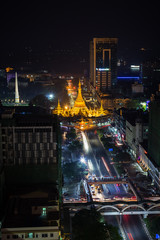Downtown, Sule Pagoda Road and lit Independence Monument and Sule Pagoda in Yangon, Myanmar, viewed from above in the evening.