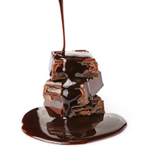 Close-up pieces of chocolate bar with filling poured liquid chocolate