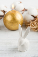 Fototapeta na wymiar Easter rabbit, golden candle