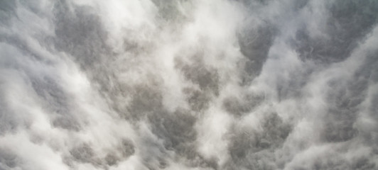 The panorama of overcast texture with clouds. Copy space.A lot of clouds in dramatic filter.
