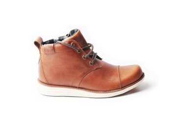 winter brown leather boots on a white background. Modern fashion and style.
