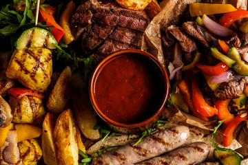 Close-up of assorted delicious grilled meat with vegetable.