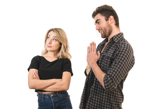 The man apologizes to a woman on the white background