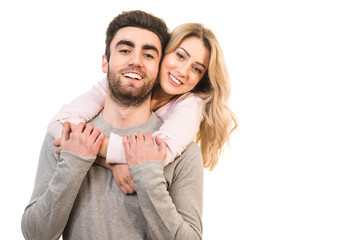 The happy man and a woman hug on the white background