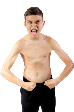Shirtless teenage boy flexing his muscles