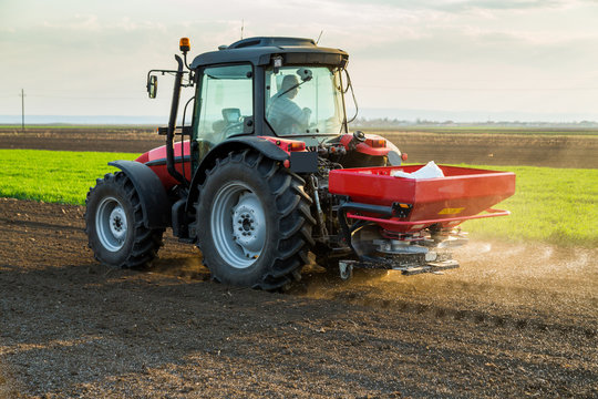 Farmer Fertilizing Arable Land With Nitrogen, Phosphorus, Potassium Fertilizer